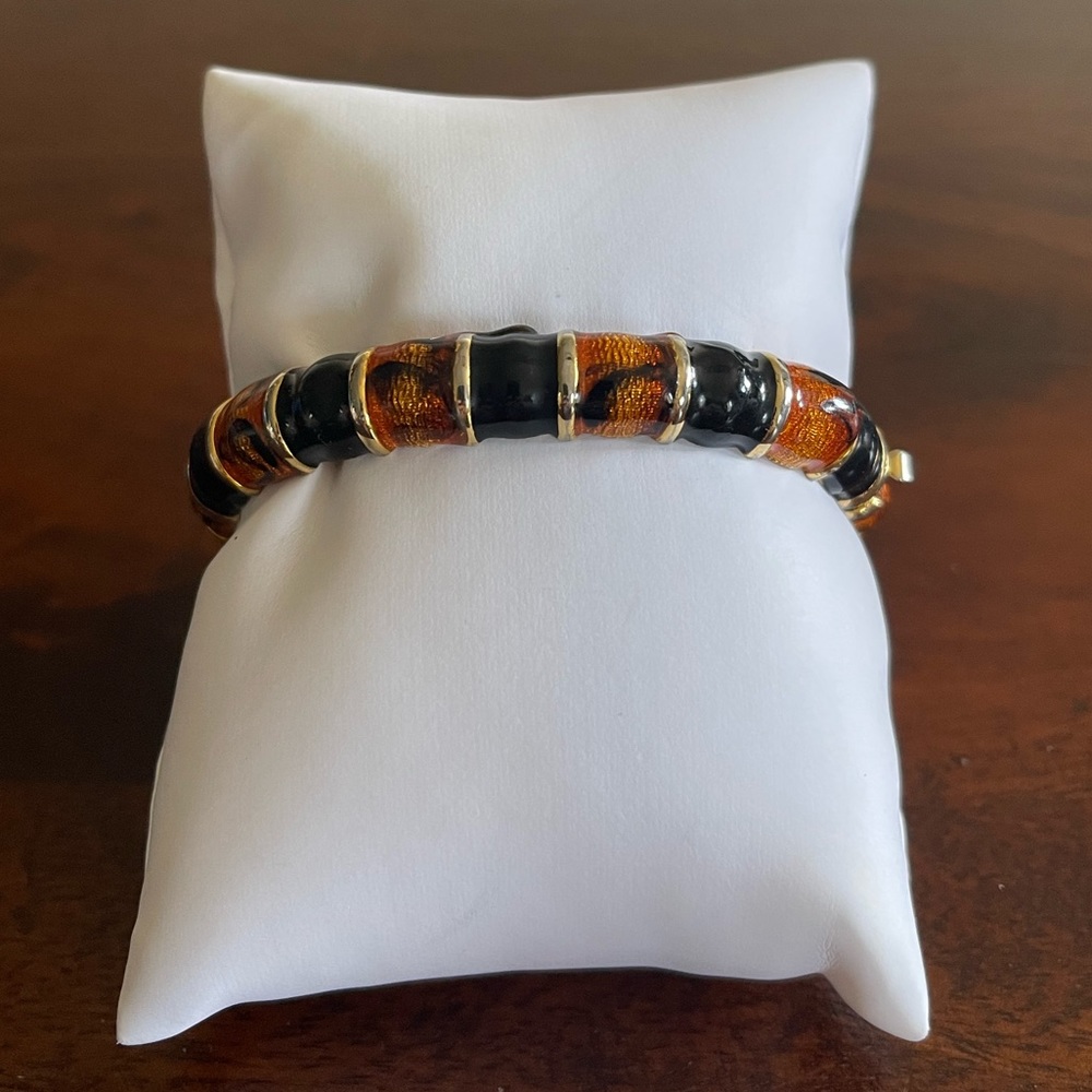 Enamelled bracelet orange black and gold done. Fits a 7.5 and smaller